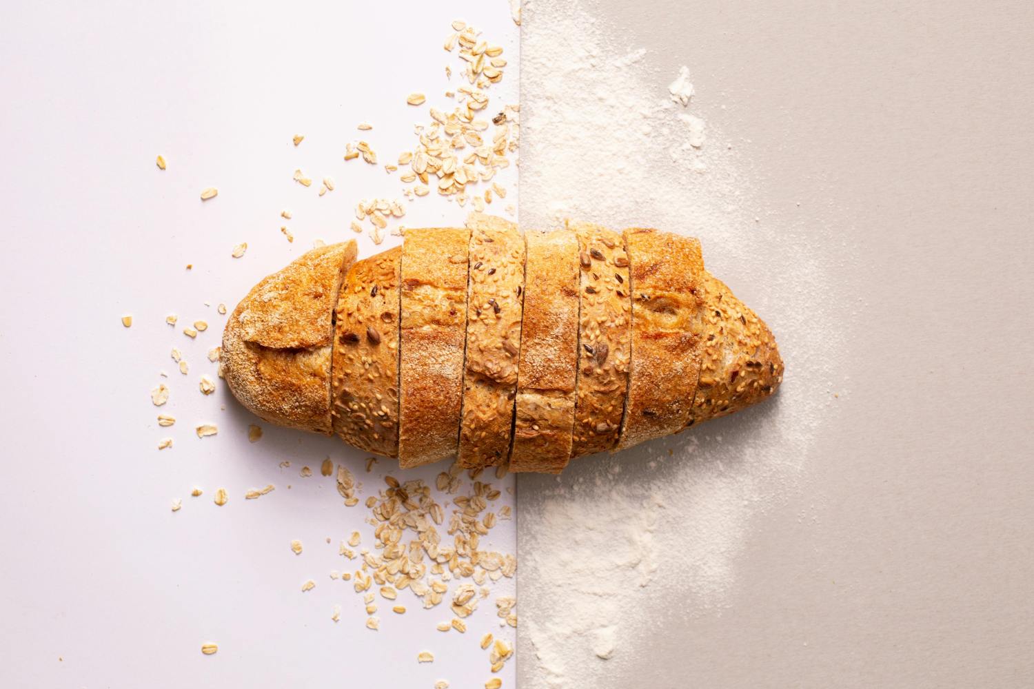 a piece of bread on a cutting board with a cake