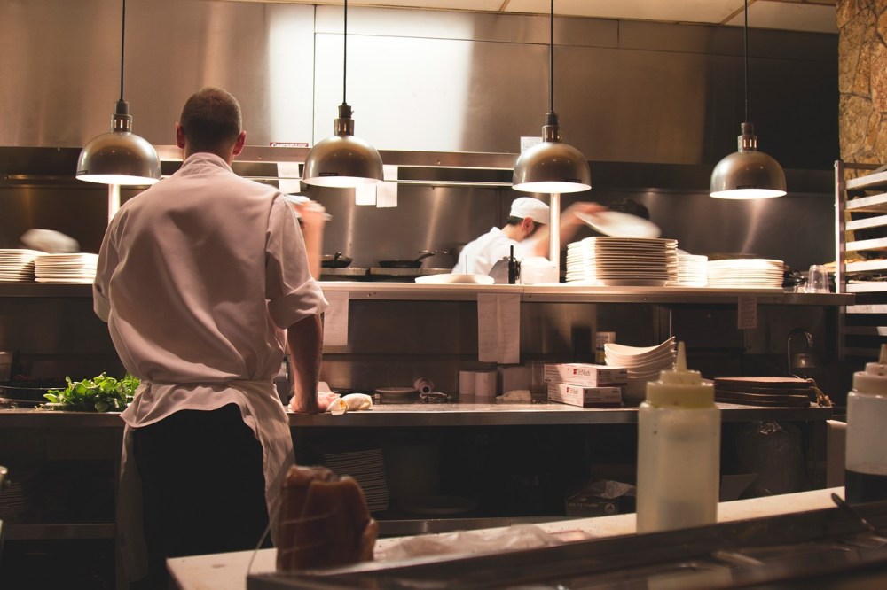 a person cooking in a kitchen